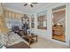 Bright sunroom with lots of natural light, comfortable seating, and views of the backyard at 1503 Pondside Ct, Summerville, SC 29485