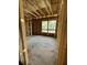 Spacious new construction bedroom featuring wood framing and windows offering lots of natural light at 1519 John Fenwick Ln, Johns Island, SC 29455