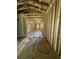 Unfinished hallway displaying the framework, offering a glimpse into the home's layout and design potential at 1519 John Fenwick Ln, Johns Island, SC 29455