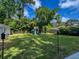 A vast backyard featuring a playset, lush greenery, and a sense of outdoor adventure and recreation at 1534 Kentwood Cir, Charleston, SC 29412