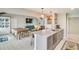 Open kitchen view features a large island with sink, stainless steel appliances, dining area, and living room at 1534 Kentwood Cir, Charleston, SC 29412