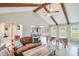 Open-concept living room featuring high ceilings, exposed beams, and stylish furniture for comfortable living at 1534 Kentwood Cir, Charleston, SC 29412