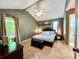 Primary bedroom boasts a vaulted ceiling, plush carpet, neutral color scheme, and ensuite bathroom at 1534 Kentwood Cir, Charleston, SC 29412