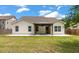 Charming home featuring a pergola-covered patio in a well-maintained, grassy backyard at 1610 Fishbone Dr, Johns Island, SC 29455