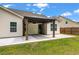 Inviting pergola-covered patio situated in a spacious backyard with lush grass and surrounding privacy fence at 1610 Fishbone Dr, Johns Island, SC 29455
