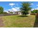 Expansive backyard featuring a mature shade tree, offering a serene outdoor space for recreation at 1610 Fishbone Dr, Johns Island, SC 29455
