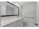 A practical bathroom with vanity, mirror, handrails, and shower-tub combination for convenience at 1610 Fishbone Dr, Johns Island, SC 29455