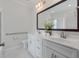Modern bathroom featuring double vanity, white marble countertop, and a framed mirror at 1610 Fishbone Dr, Johns Island, SC 29455