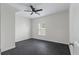 This bedroom features a ceiling fan and neutral paint, providing a simple, functional space at 1610 Fishbone Dr, Johns Island, SC 29455