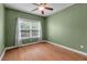 Cozy bedroom with hardwood floors and a large window at 1610 Fishbone Dr, Johns Island, SC 29455