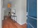 Bright entryway with hardwood floors, modern console table decor, and open view to the cozy living room at 1610 Fishbone Dr, Johns Island, SC 29455