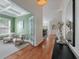 Bright foyer with hardwood floors and views into living spaces; featuring light walls and modern decor at 1610 Fishbone Dr, Johns Island, SC 29455