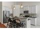 Kitchen showcases granite countertops, stainless steel appliances, and white cabinetry for a modern aesthetic at 1610 Fishbone Dr, Johns Island, SC 29455