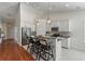 Well-lit kitchen features an island with bar stools and stainless steel appliances for a modern touch at 1610 Fishbone Dr, Johns Island, SC 29455