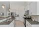 Kitchen showcases granite countertops, stainless steel appliances, and bright cabinetry for a modern aesthetic at 1610 Fishbone Dr, Johns Island, SC 29455