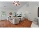 Spacious living room with high ceilings, hardwood floors, and stylish furniture arrangement for a cozy atmosphere at 1610 Fishbone Dr, Johns Island, SC 29455