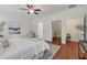 Bright bedroom features hardwood floors, a neutral color palette, and large walk-in closet at 1610 Fishbone Dr, Johns Island, SC 29455