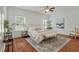Tranquil bedroom features hardwood floors, a neutral color palette, and ample natural light at 1610 Fishbone Dr, Johns Island, SC 29455
