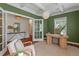 Stylish office space with green walls, natural light, and a modern desk setup, perfect for productivity at 1610 Fishbone Dr, Johns Island, SC 29455
