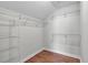 This organized walk-in closet features multiple shelves and racks for efficient storage at 1610 Fishbone Dr, Johns Island, SC 29455