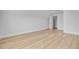 Spacious bedroom with wood-look flooring, white trim, and bright natural light at 168 Cotillion Cres, Summerville, SC 29483