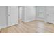 A bright, neutral bedroom showcases light wood floors and contemporary white trim at 168 Cotillion Cres, Summerville, SC 29483