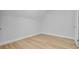 A minimalist bedroom with a light-filled window and light wood floors at 168 Cotillion Cres, Summerville, SC 29483