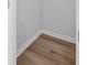 Walk-in closet featuring wood-look flooring, white trim, and ample storage space at 168 Cotillion Cres, Summerville, SC 29483