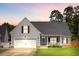 Beautiful gray home featuring a manicured lawn and welcoming front porch at 168 Cotillion Cres, Summerville, SC 29483