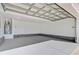 Spacious and clean garage with a neutral painted floor and modern door at 168 Cotillion Cres, Summerville, SC 29483