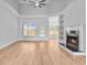 Spacious living room with fireplace, shelving, and outdoor views at 168 Cotillion Cres, Summerville, SC 29483