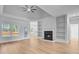 Bright living room features a fireplace, built-in shelving, and large windows for ample natural light at 168 Cotillion Cres, Summerville, SC 29483