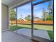 Relax on the screened porch overlooking the expansive and well-maintained lawn at 168 Cotillion Cres, Summerville, SC 29483