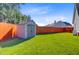 View of the backyard storage shed with a large grassy lawn and privacy fence at 168 Cotillion Cres, Summerville, SC 29483