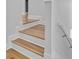 Staircase with wood treads and risers, white trim, and walls at 168 Cotillion Cres, Summerville, SC 29483