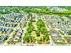 Stunning aerial view of a well-planned residential community featuring lush green spaces, picturesque ponds, and neatly arranged homes at 1708 Waterbrook Dr, Charleston, SC 29414