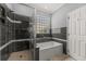 Modern bathroom with tiled shower, separate tub and decorative accent tiles at 1708 Waterbrook Dr, Charleston, SC 29414