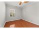 Bedroom showcasing hardwood floors and one large window with views of the yard at 1708 Waterbrook Dr, Charleston, SC 29414