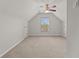 Large bonus room with neutral carpeting, ceiling fan, and natural light from a window at 1708 Waterbrook Dr, Charleston, SC 29414
