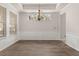 Bright dining room with hardwood floors, large windows, and chandelier at 1708 Waterbrook Dr, Charleston, SC 29414
