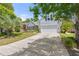 Charming home with a well-manicured lawn, mature landscaping, and a spacious driveway leading to a two-car garage at 1708 Waterbrook Dr, Charleston, SC 29414