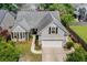 Charming gray home with manicured landscaping and an attached two-car garage in a desirable neighborhood at 1708 Waterbrook Dr, Charleston, SC 29414