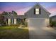Charming home with a two-car garage, manicured lawn, and inviting front facade at 1708 Waterbrook Dr, Charleston, SC 29414