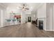 Open floor plan showcasing living room with fireplace adjacent to kitchen with breakfast bar at 1708 Waterbrook Dr, Charleston, SC 29414
