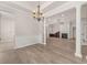 Open living space features wood floors, pillars, and fireplace at 1708 Waterbrook Dr, Charleston, SC 29414