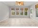 Bright sunroom features tile floors, multiple windows and ceiling fan at 1708 Waterbrook Dr, Charleston, SC 29414