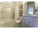 Well-lit bathroom featuring a shower-tub combo and white vanity with marble countertop at 172 Helena Park Dr, Summerville, SC 29486