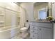 Bathroom featuring a combined tub and shower, vanity, and marble tile floors at 172 Helena Park Dr, Summerville, SC 29486