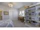 Bright bedroom featuring a decorative chandelier, window, and built in shelving at 172 Helena Park Dr, Summerville, SC 29486