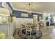Charming dining room with elegant lighting, a blue accent wall, and a round table at 172 Helena Park Dr, Summerville, SC 29486